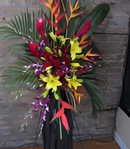 Colorful floral arrangement with tropical flowers.