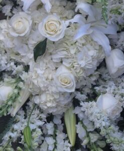 White roses and lilies floral arrangement.