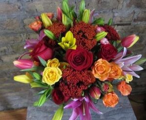 Colorful bouquet with roses and lilies.