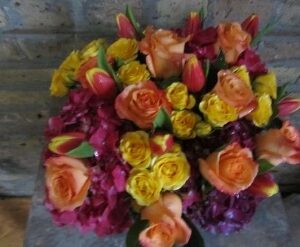 Colorful bouquet of roses and tulips.